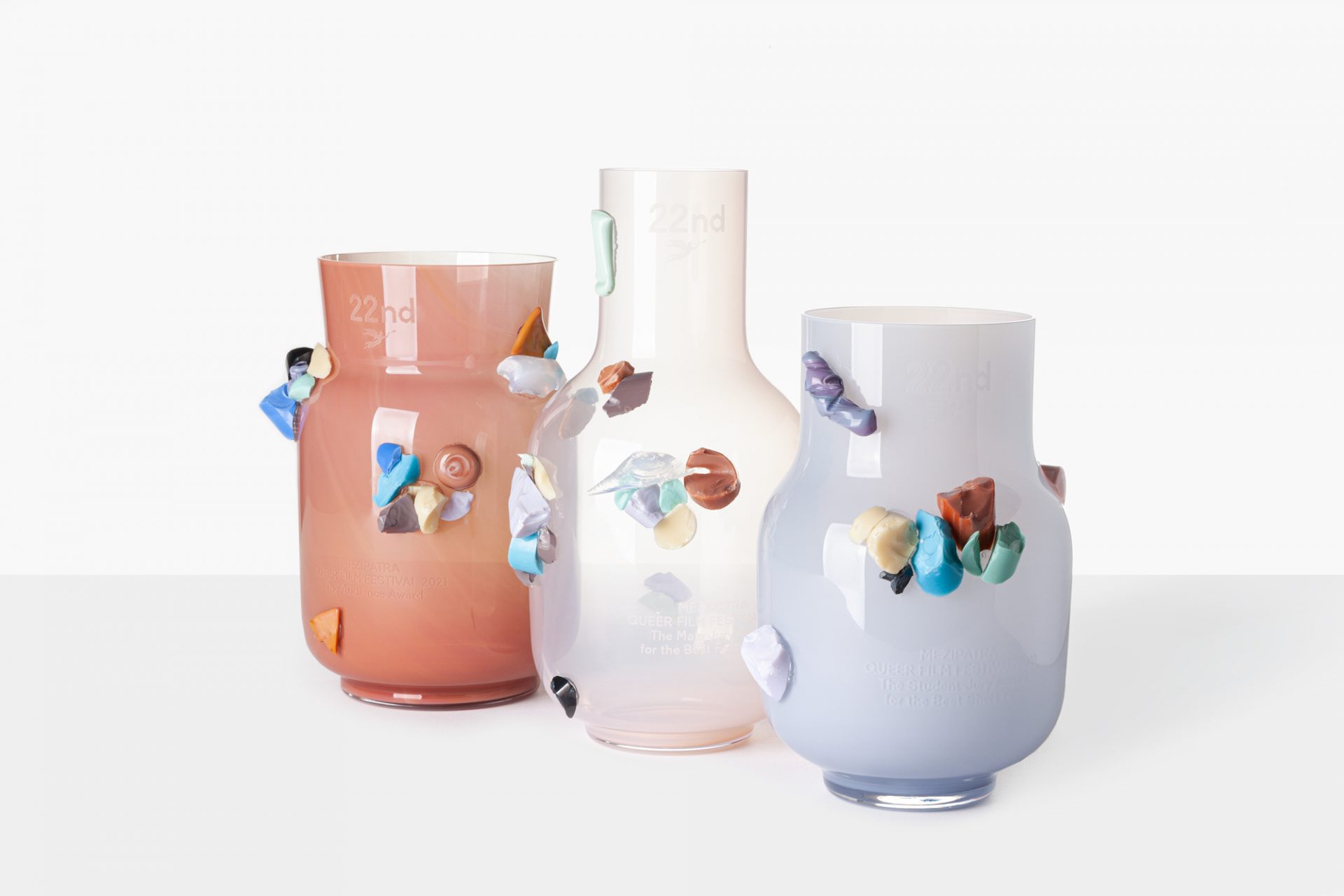 Three colourful festive vases