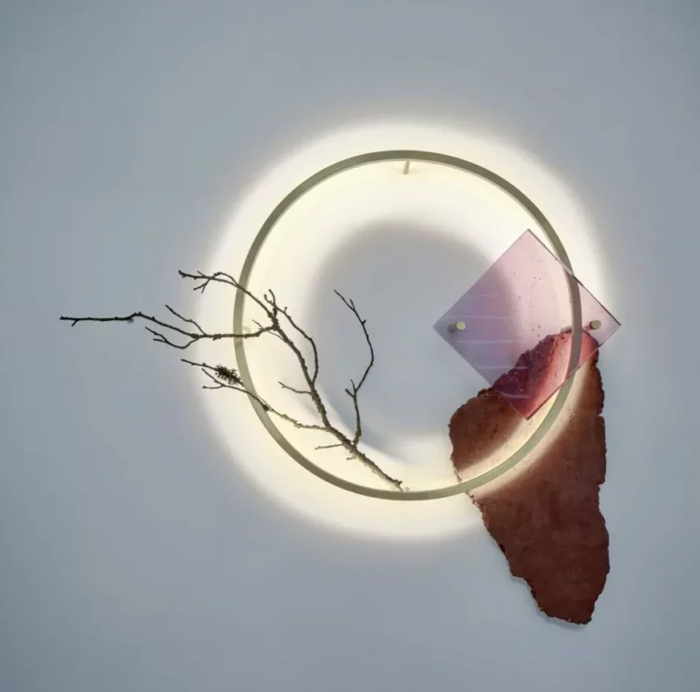 Abstract art with circle light, branch, and geometric shapes.